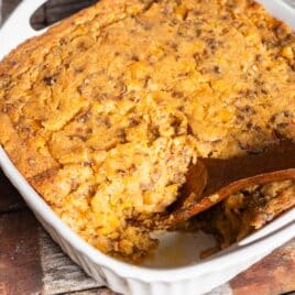 taco corn casserole with a wooden spoon