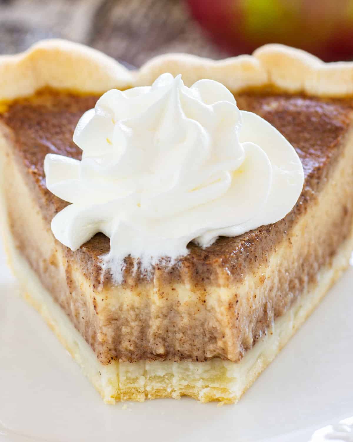 apple butter pie with whipped cream on a plate