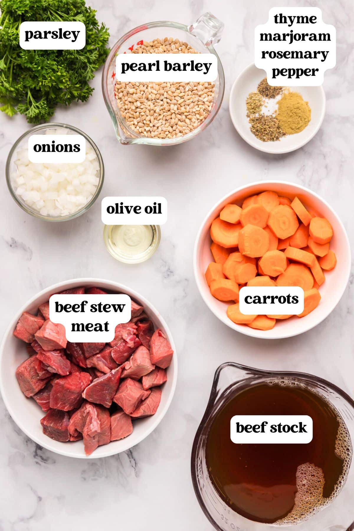 ingredients for beef barley soup on a table