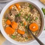 a bowl of pearl barley soup with beef