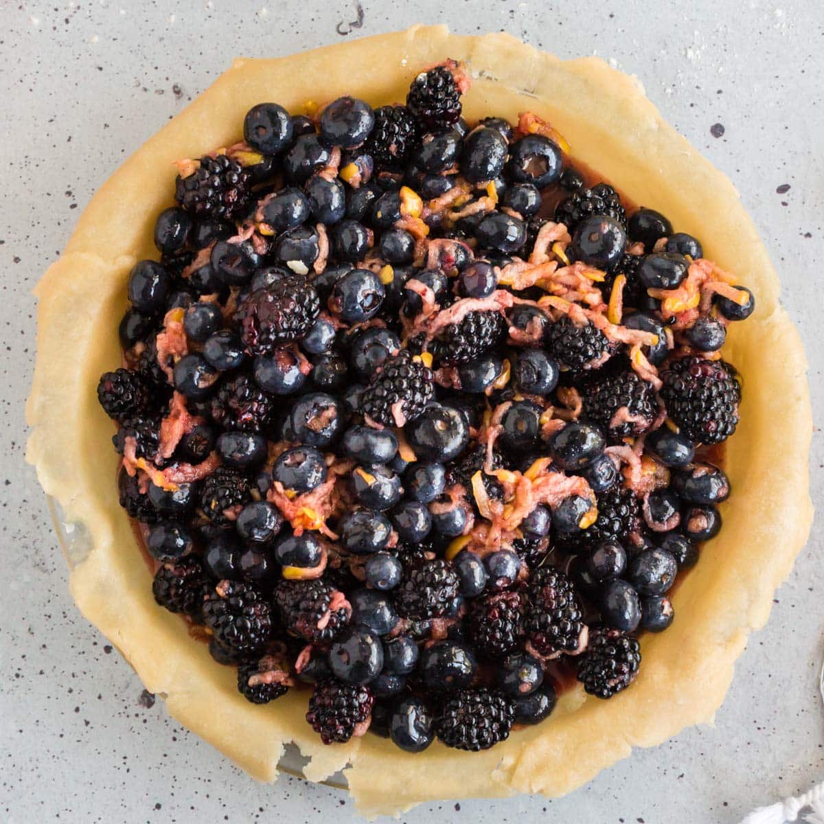 blackberries and blueberries in a pie crust