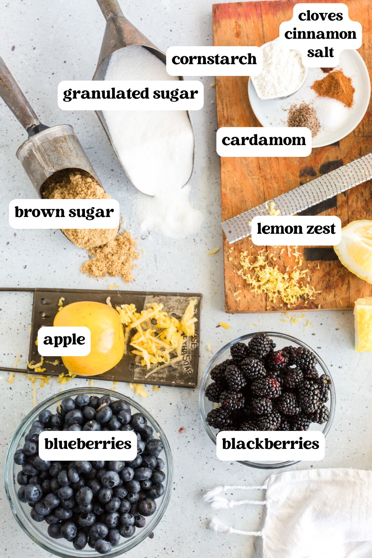 ingredients for blueberry blackberry pie on a table