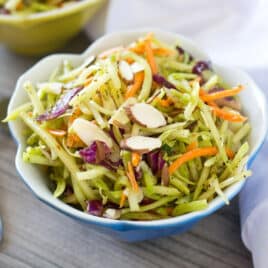 a small bowl of paleo broccoli slaw with almonds