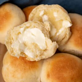 closeup of brown and serve rolls with butter