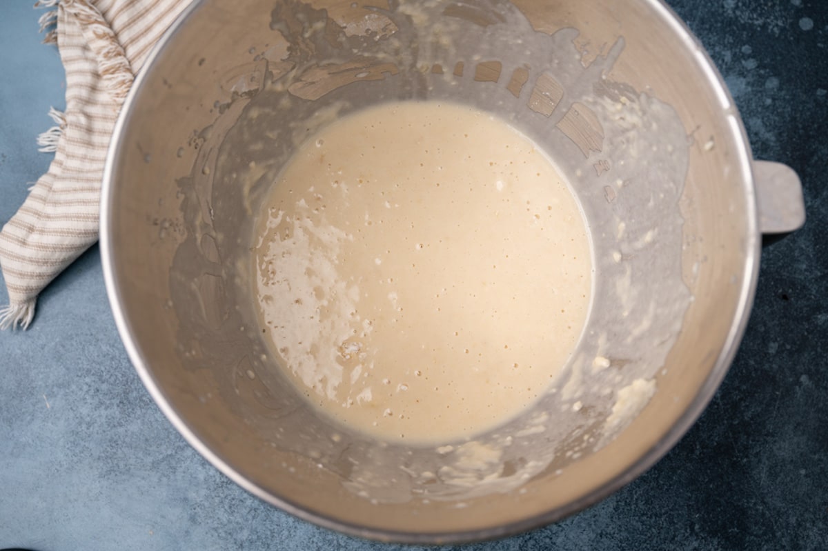 frothed yeast in a metal bowl