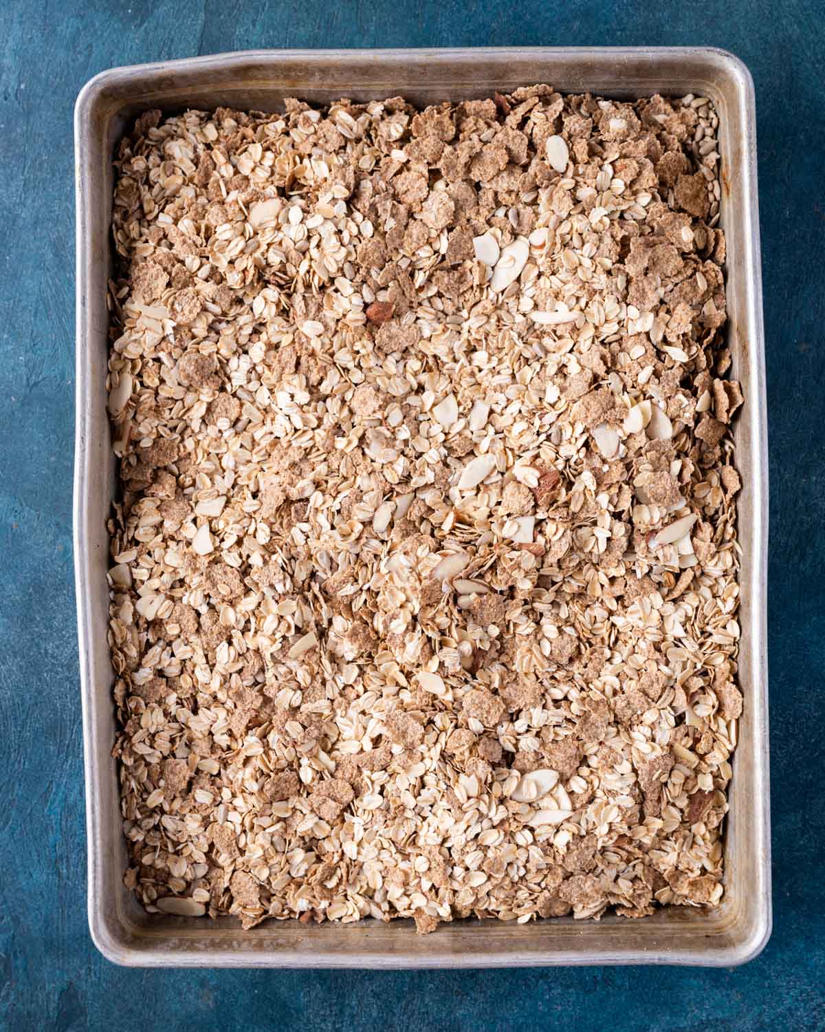 dry ingredients for granola in a baking pan