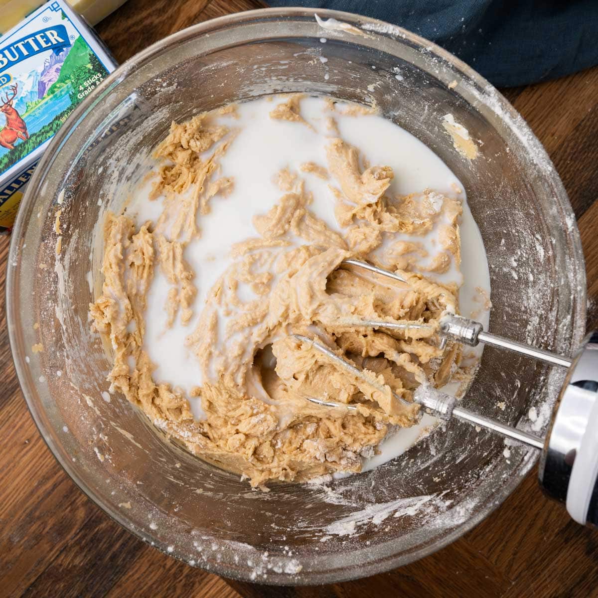 mixing milk into cake batter