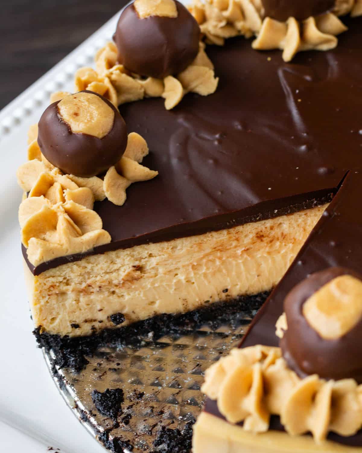 overhead view of a peanut butter buckeye cheesecake with a slice out