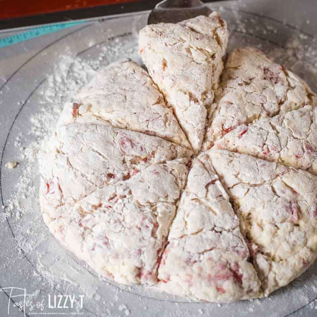 unbaked buttermilk cherry scones on a pastry mat