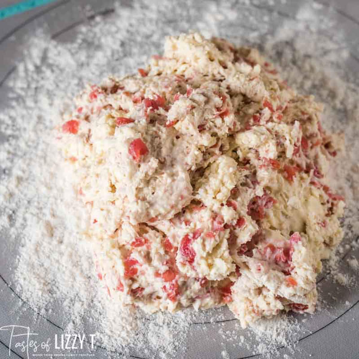 buttermilk cherry scone dough on a pastry mat