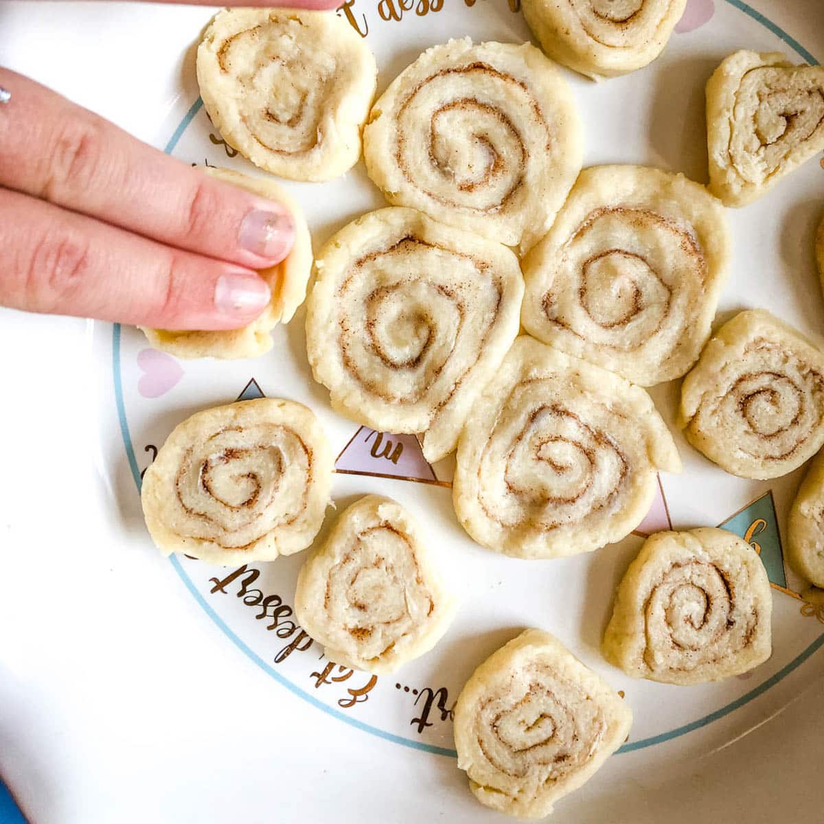 pressing pie dough swirls in a pie pan