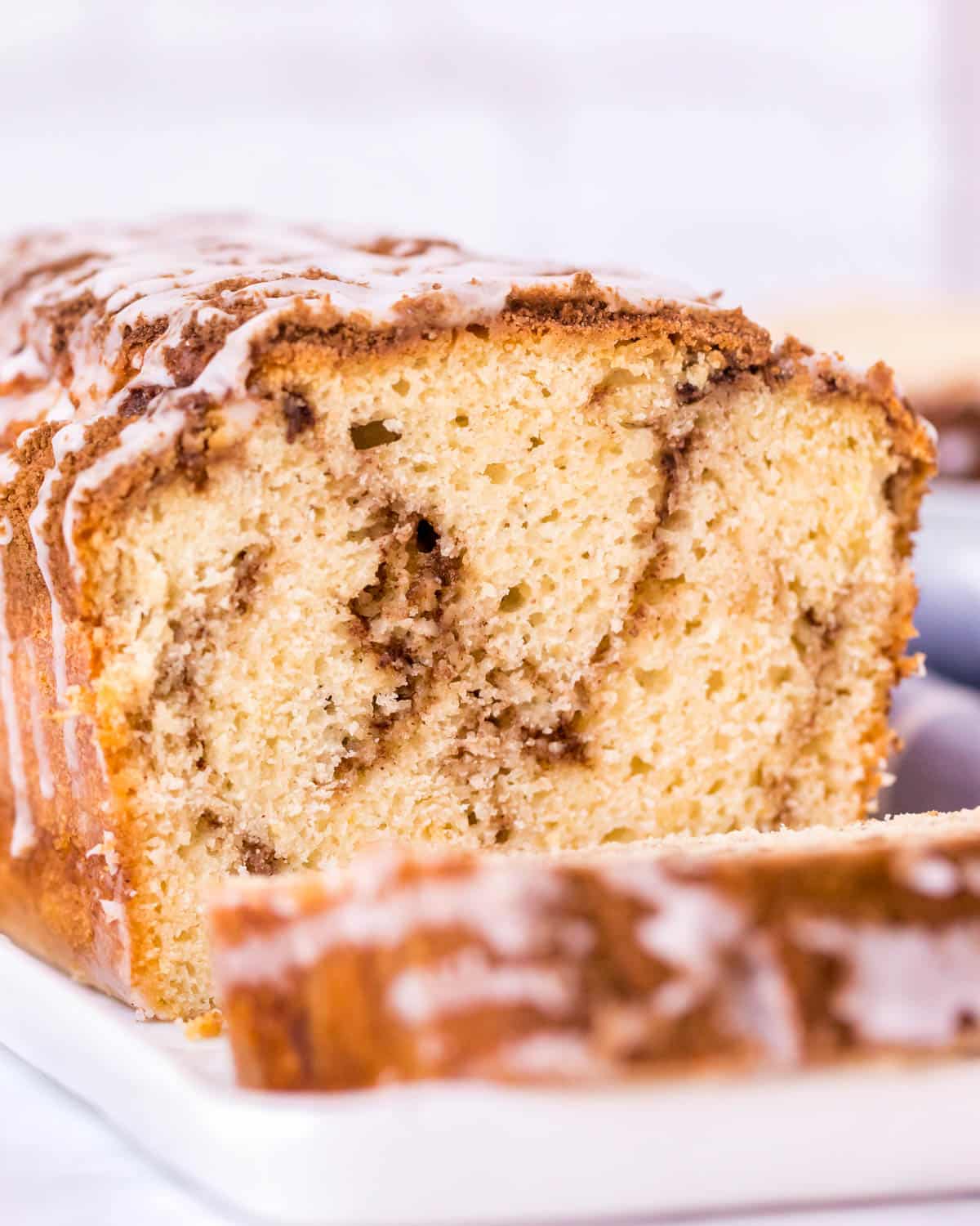 inside a loaf of cinnamon swirl bread with glaze on top