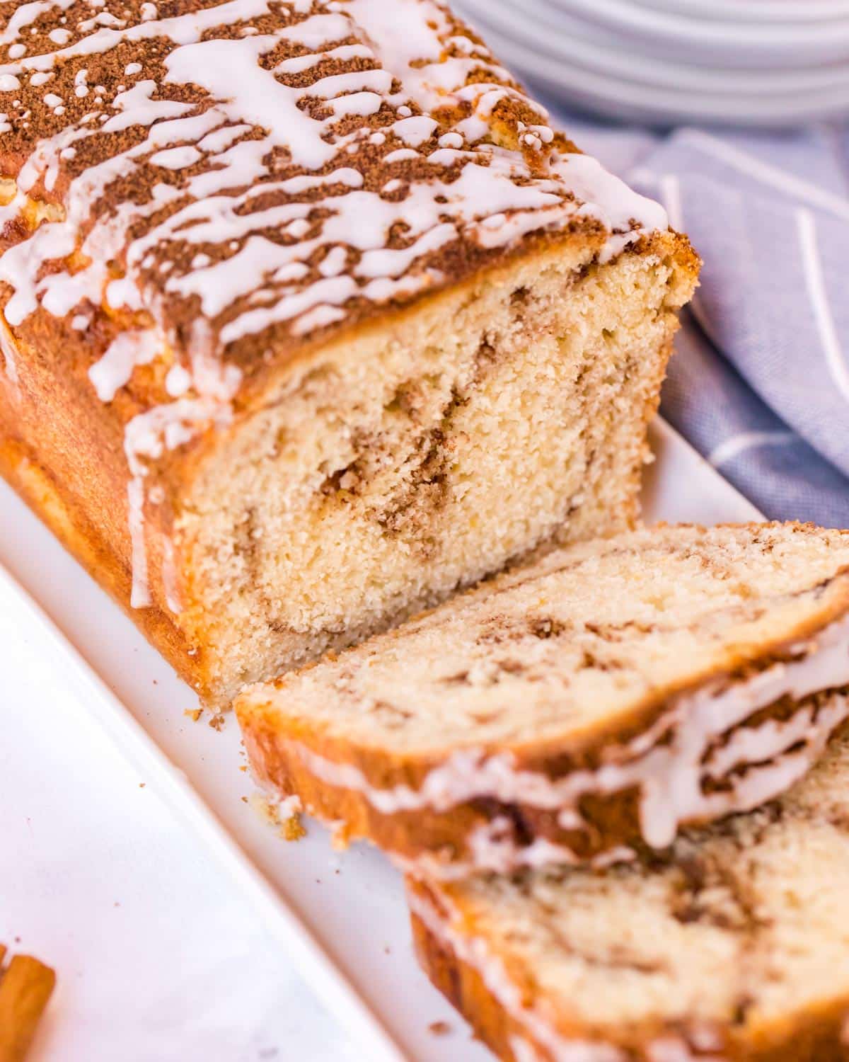 cinnamon swirl quick bread sliced on a plate