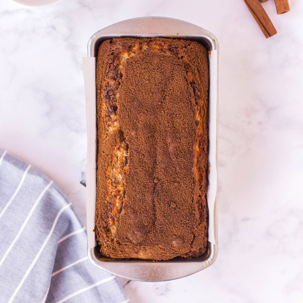 baked cinnamon swirl quick bread in a pan