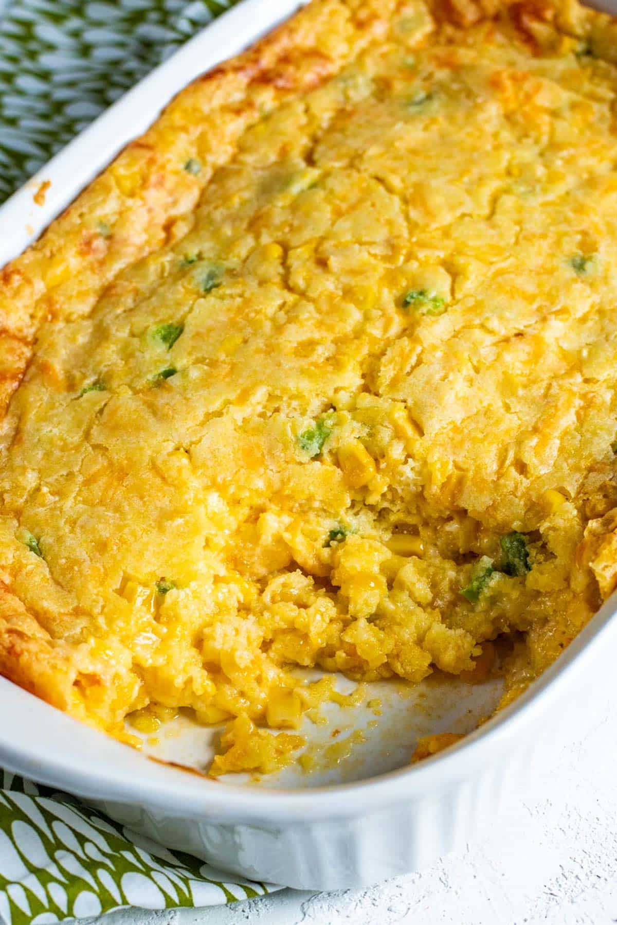 corn casserole with jalalpenos in a baking dish