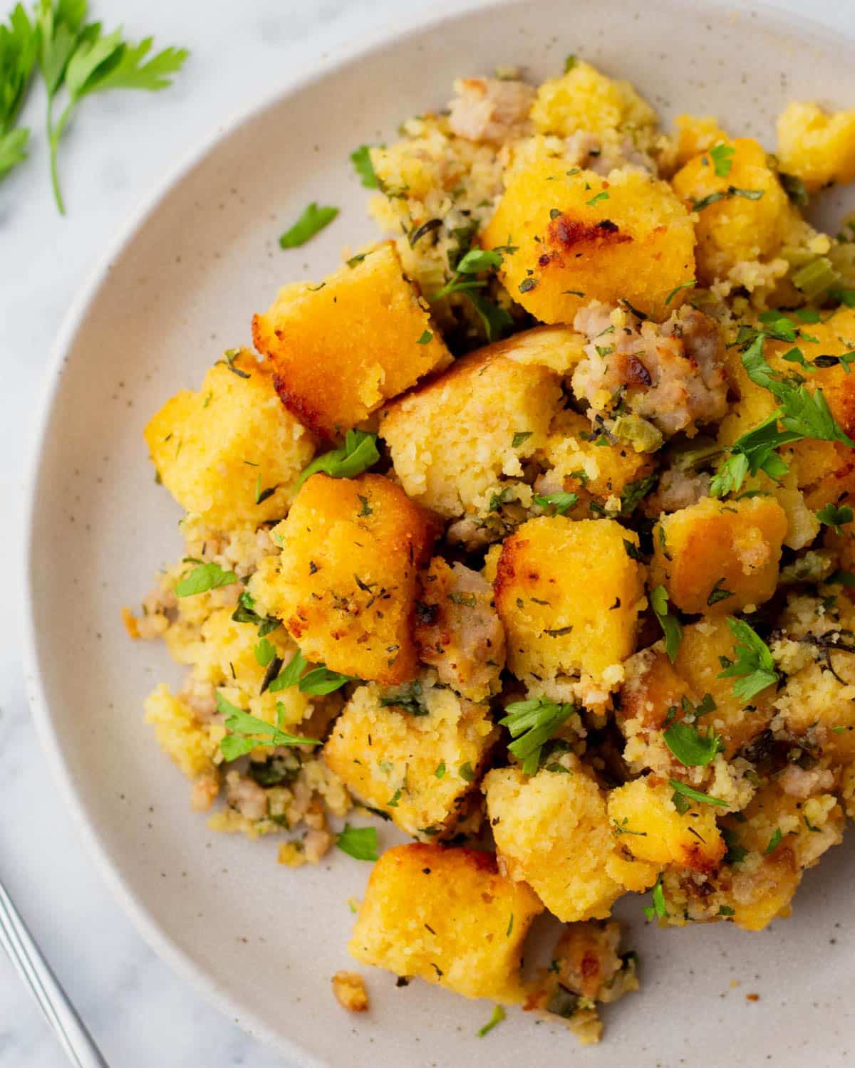 overhead view of a plate of cornbread stuffing with jimmy dean sausage