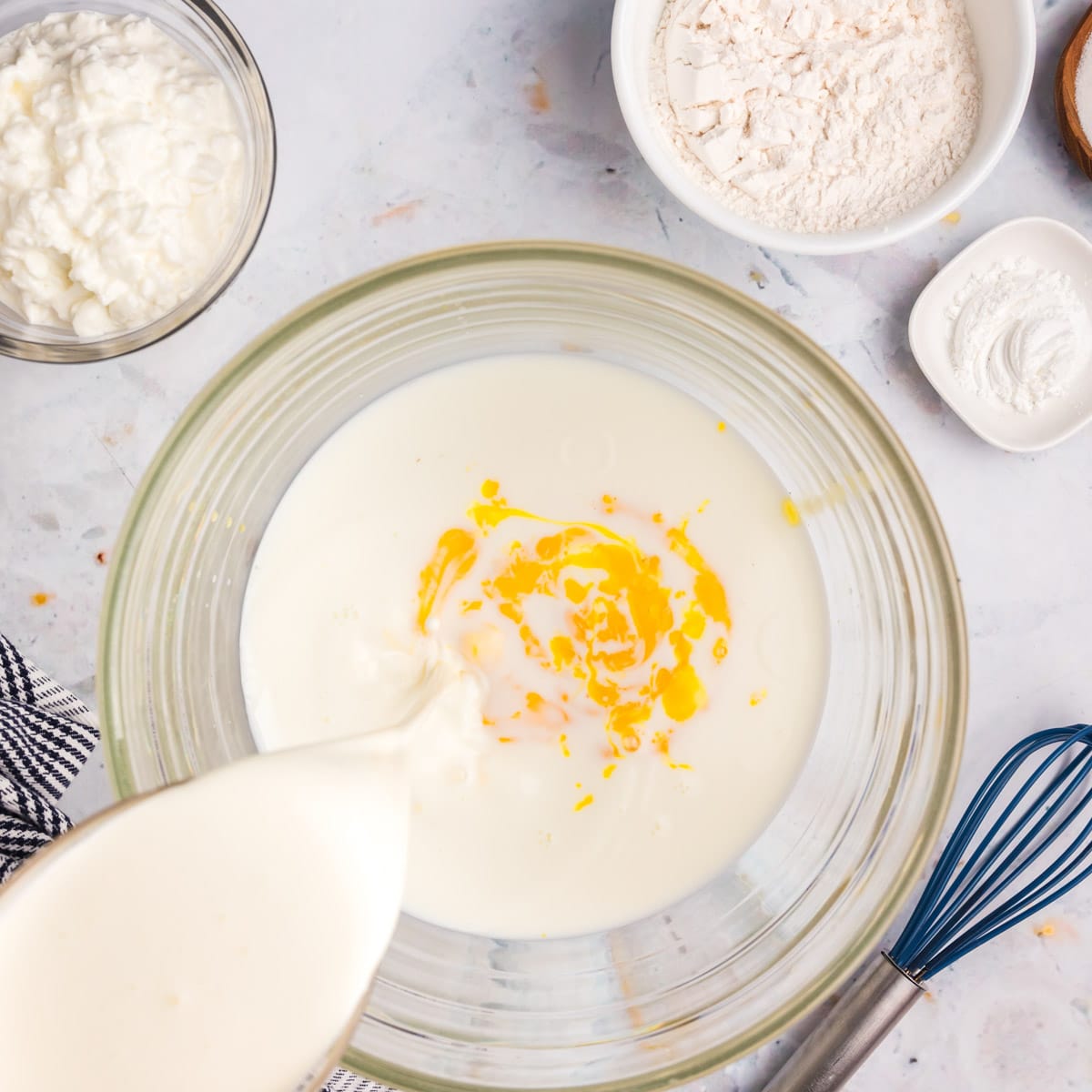 milk pouring into a bowl