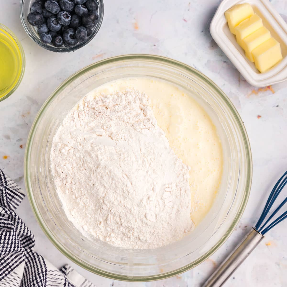 dry ingredients over wet ingredients in a bowl