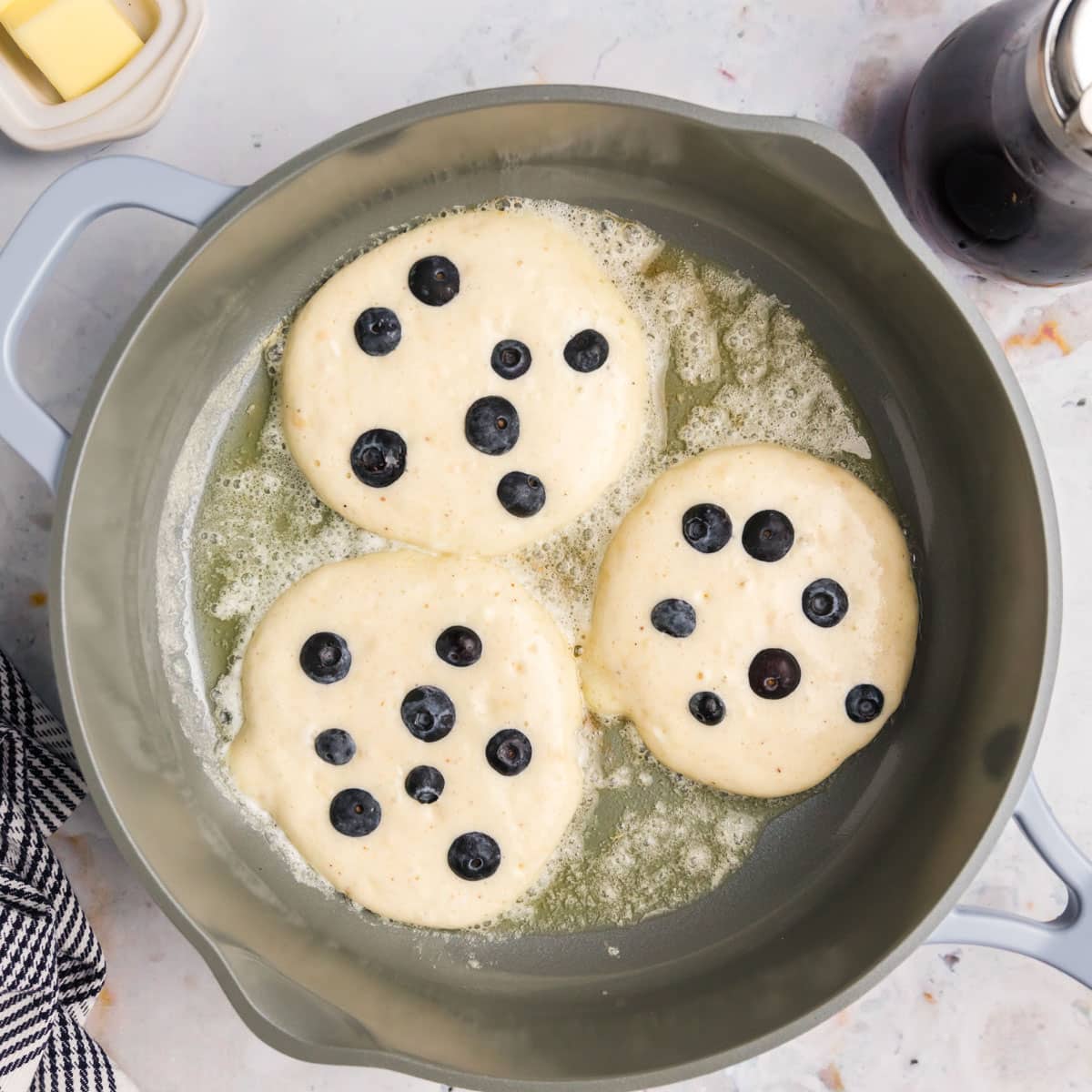 3 cottage cheese pancakes in a frying pan