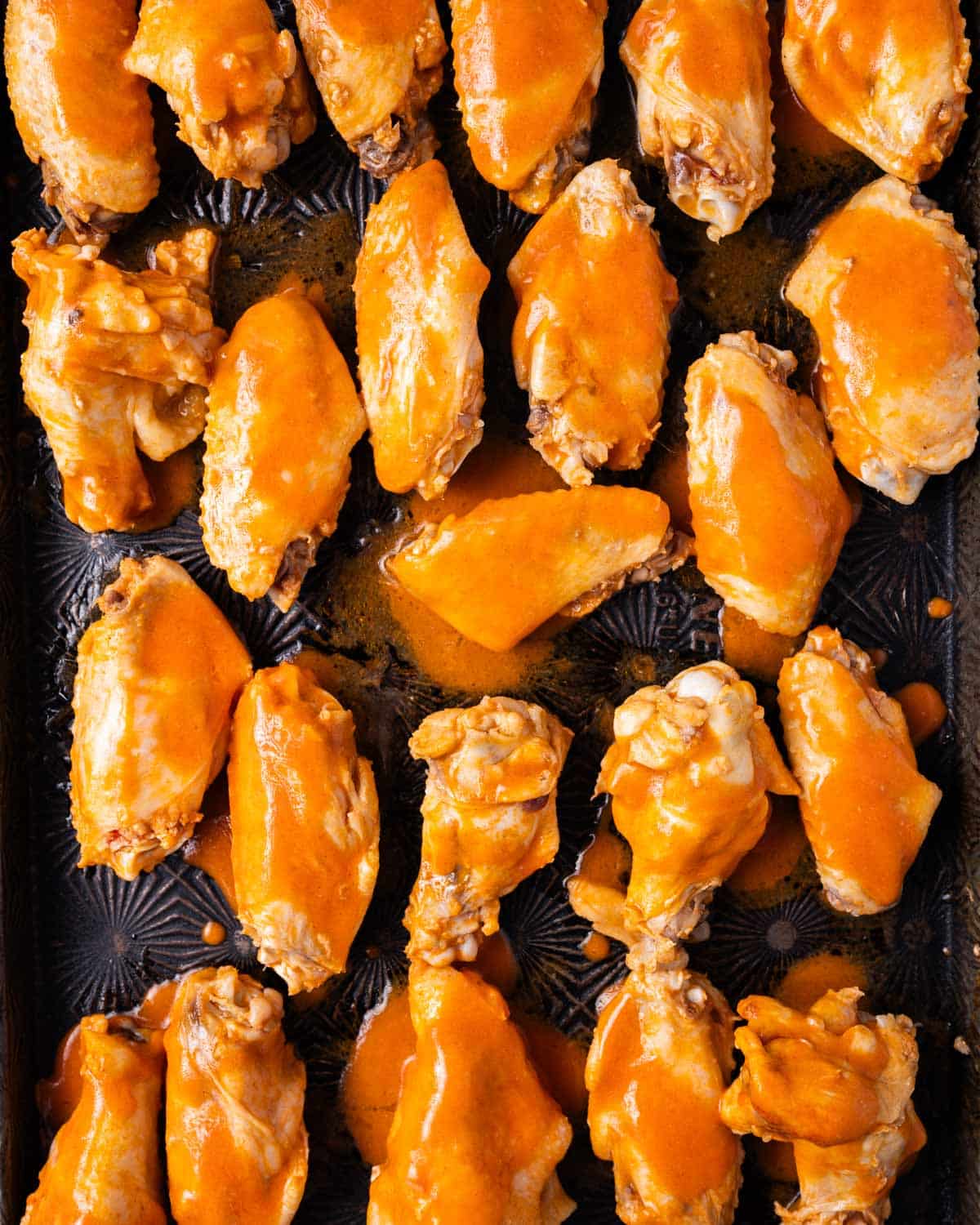 buffalo chicken wings on a baking sheet