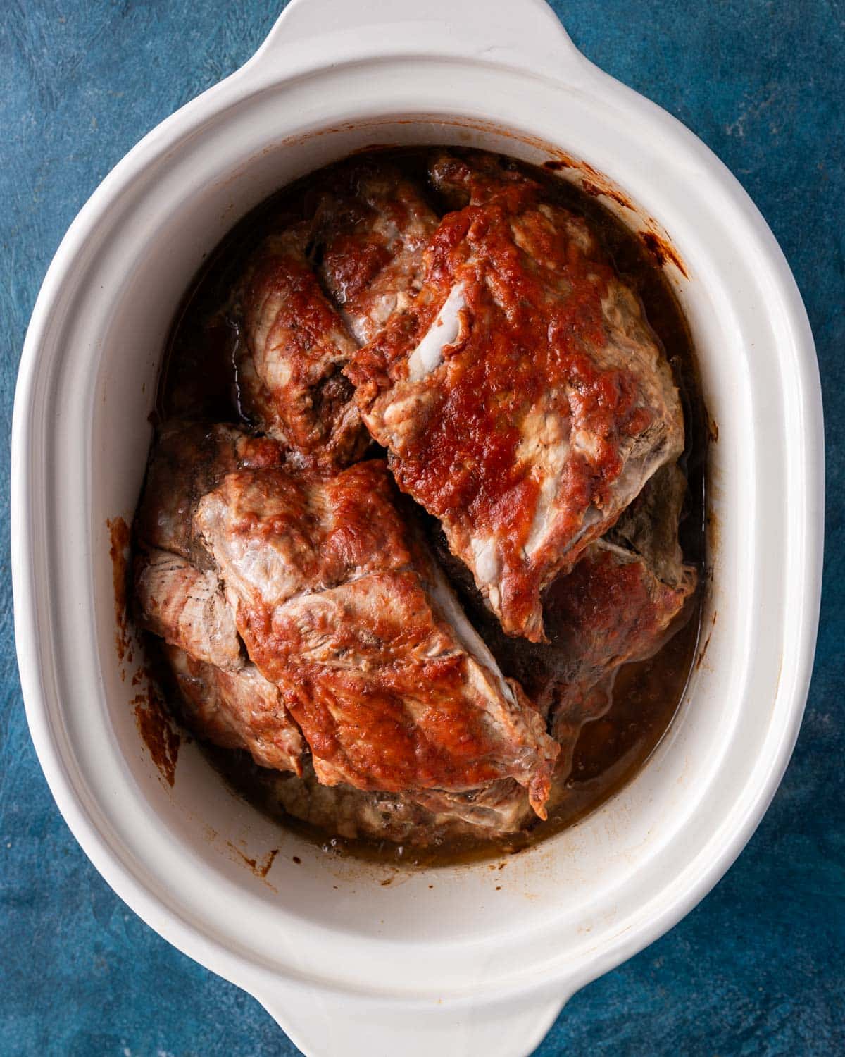 cooked ribs in a crockpot