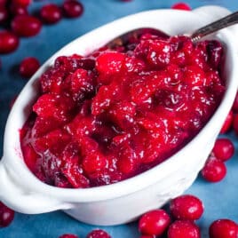 homemade cranberry sauce in a bowl with a spoon