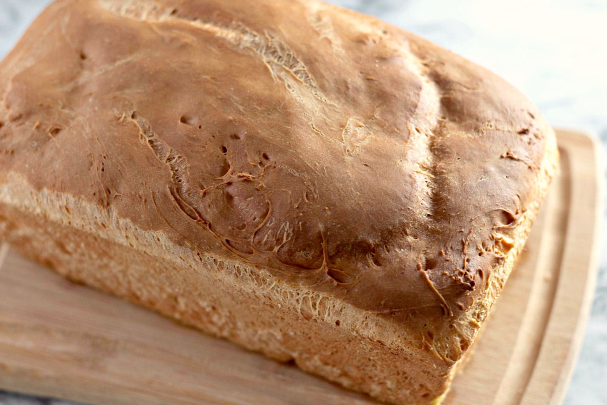 a loaf of english toasting bread on a cutting board