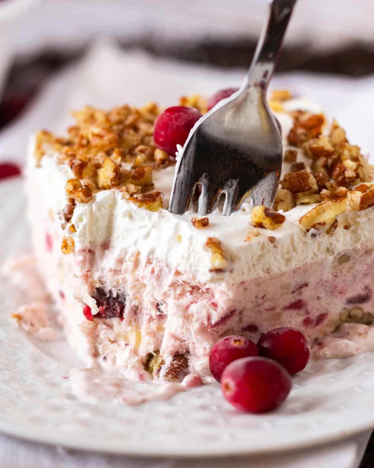 a fork going into a cranberry dessert