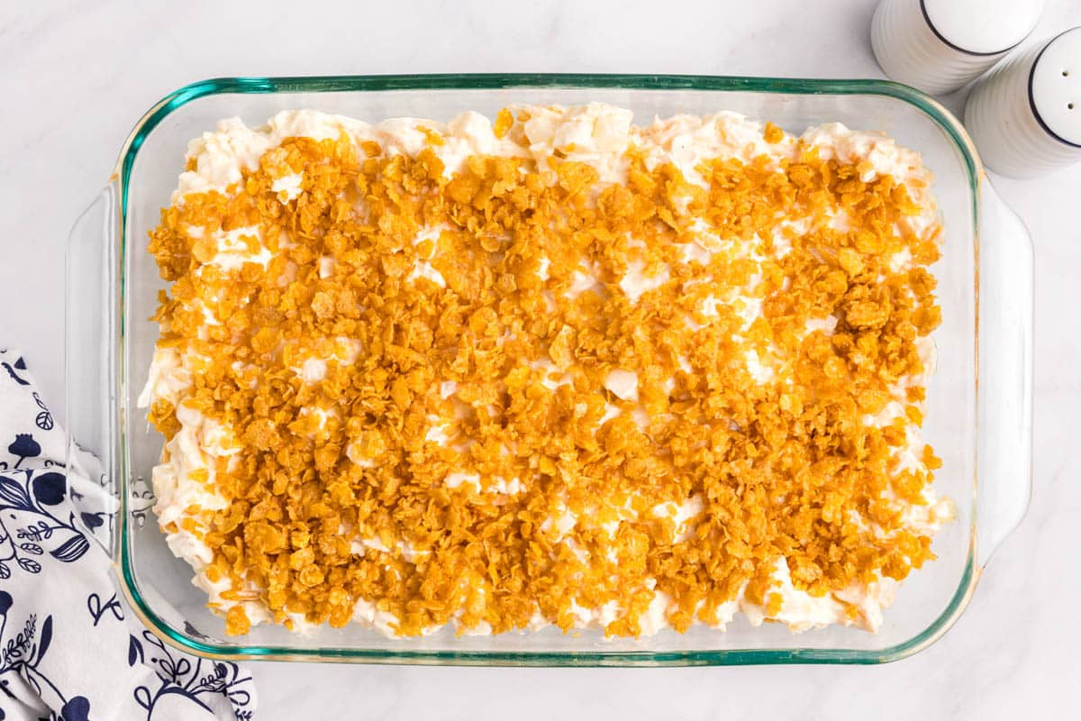 unbaked funeral potatoes in a casserole dish