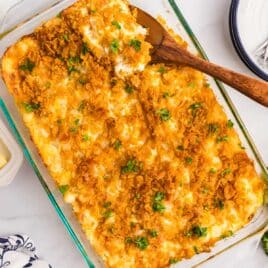 overhead view of funeral potatoes casserole in a baking dish