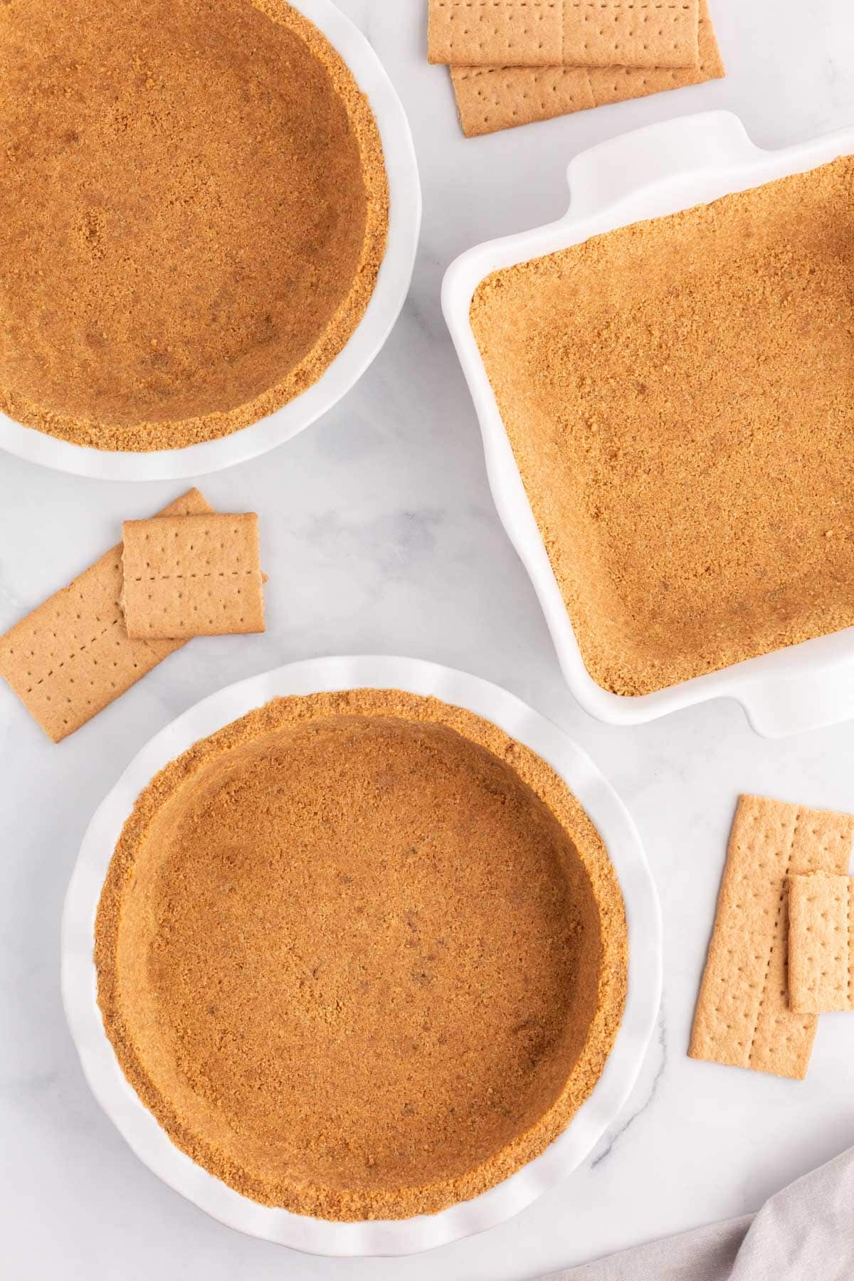 graham cracker pie crusts on a table