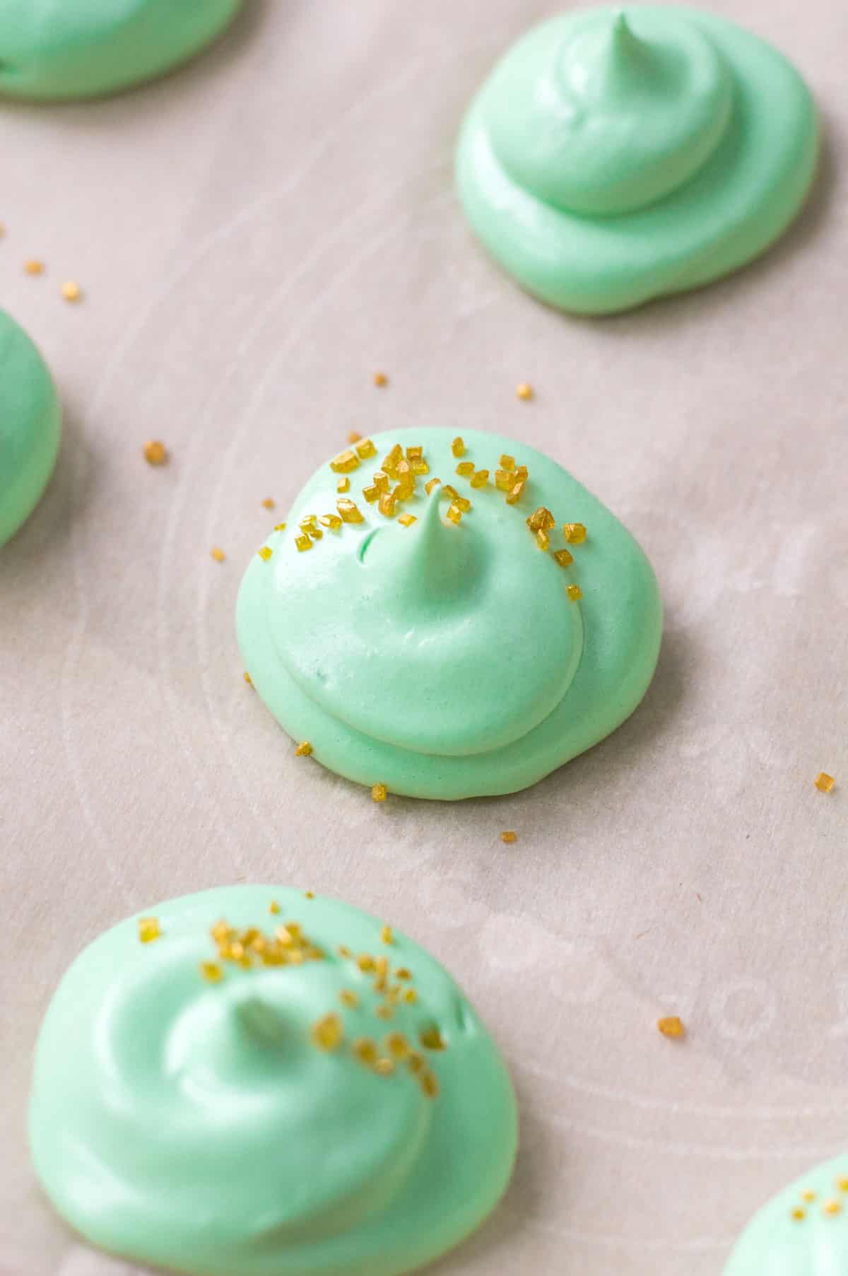 green meringue cookie drops with sprinkles