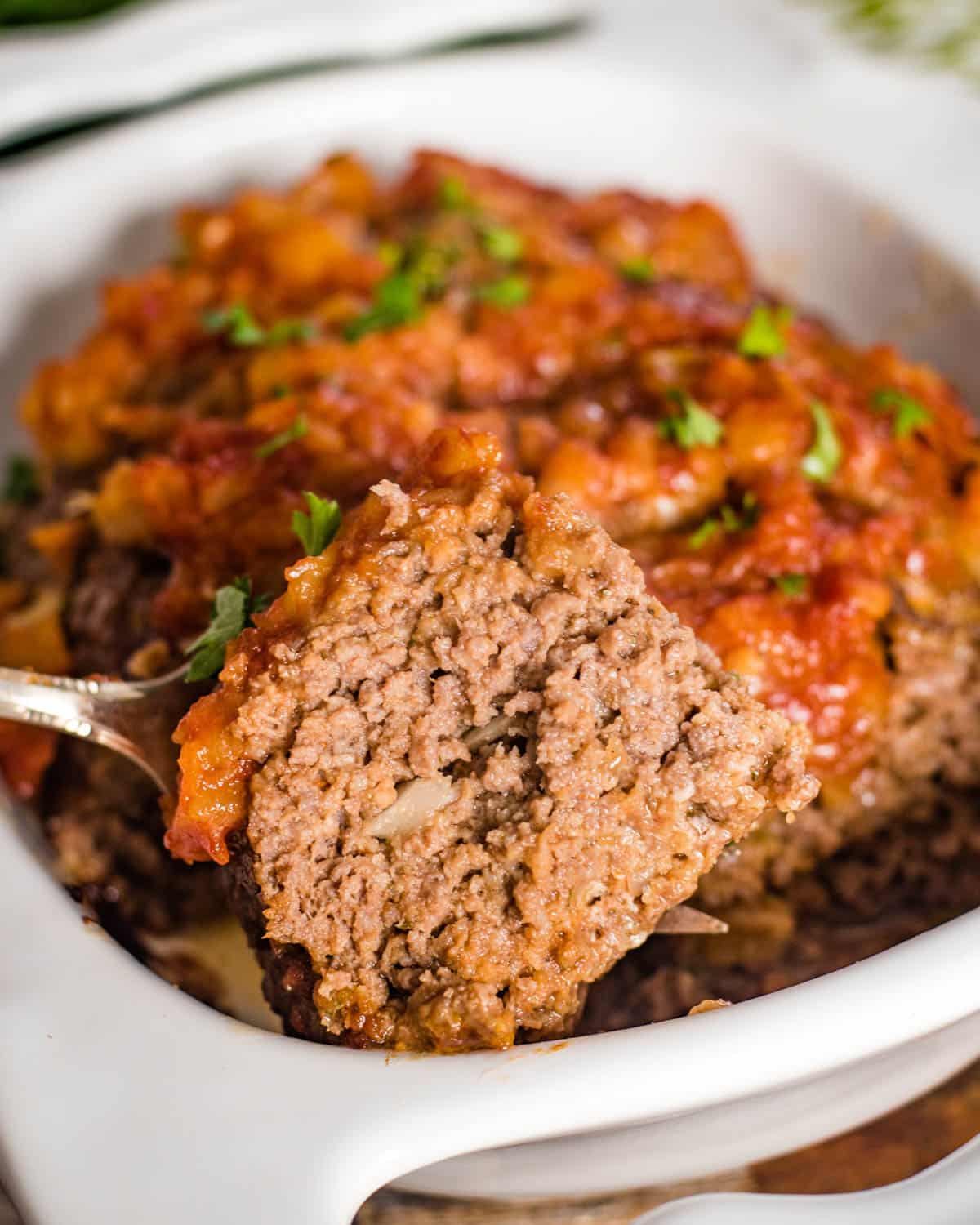 a piece of meatloaf on a serving fork