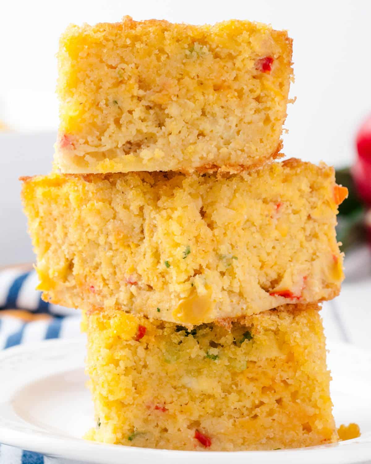 a stack of cornbread with peppers and cheese