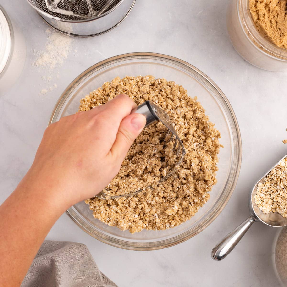 pastry cutter cutting ingredients together in a bowl