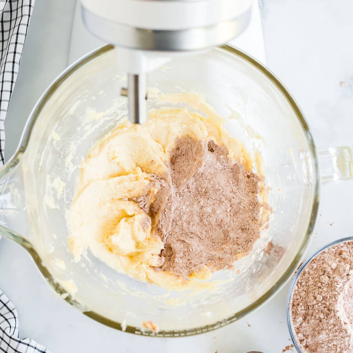 dry ingredients over creamed butter in a mixing bowl