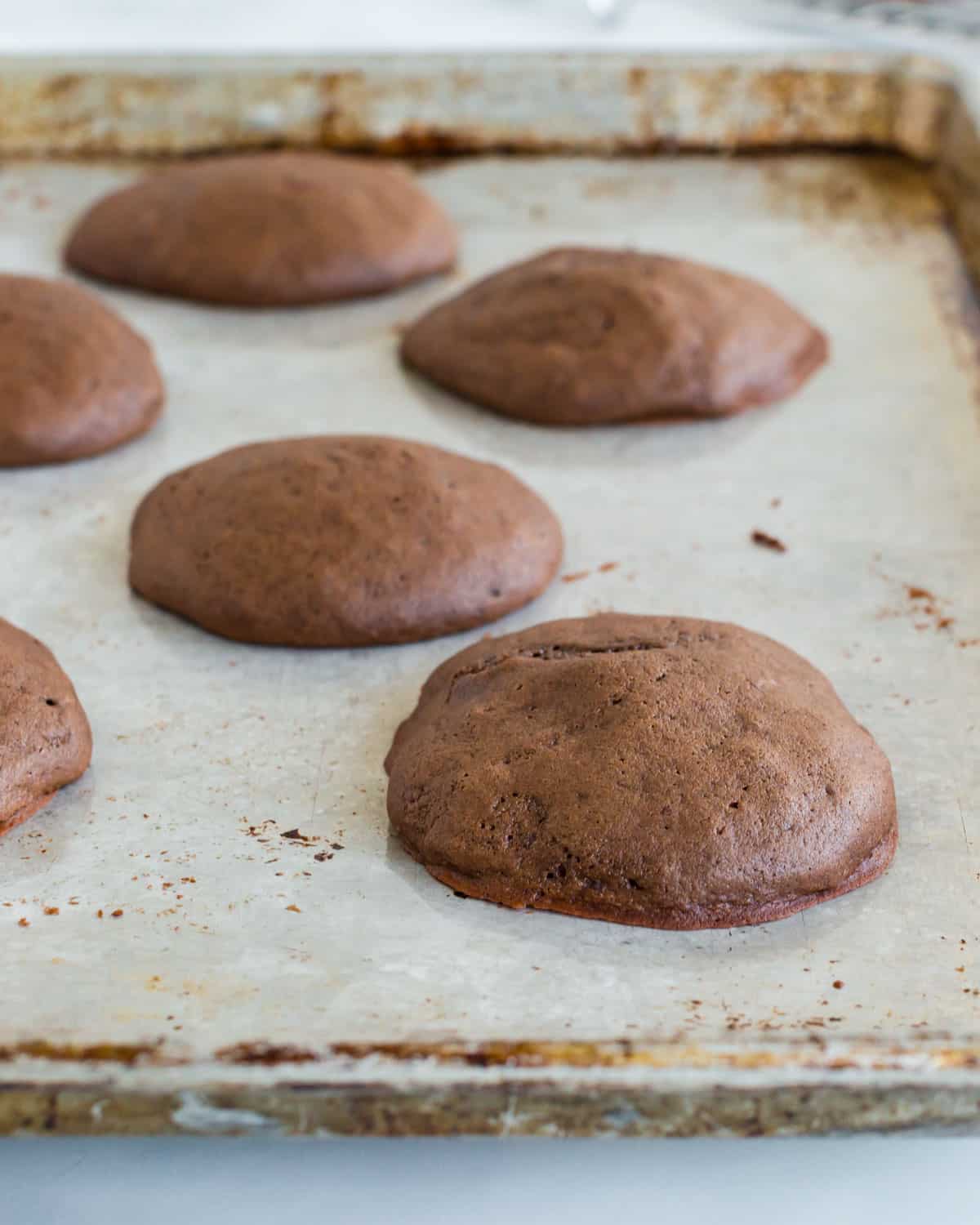 baked whoopie pie cakes on a baking sheet