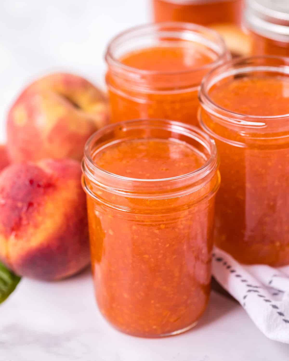 jars of peach jam for the freezer