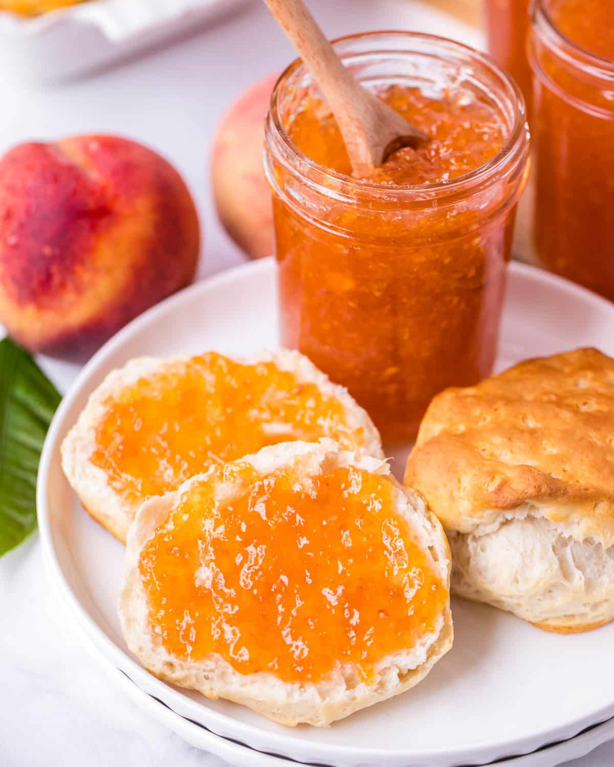 biscuits with peach jam on a plate