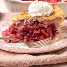 pear cranberry pie on a plate