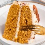 a fork cutting into a piece of pumpkin spice cake