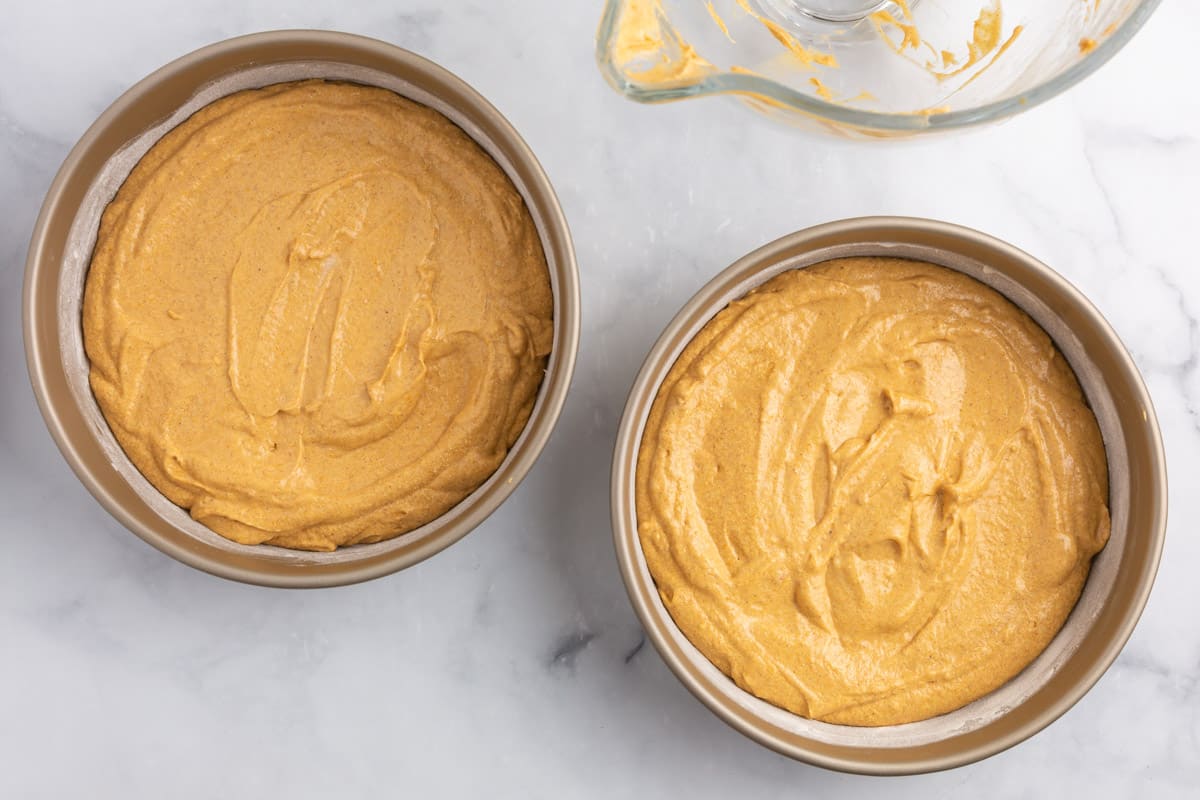 two unbaked pumpkin spice cakes