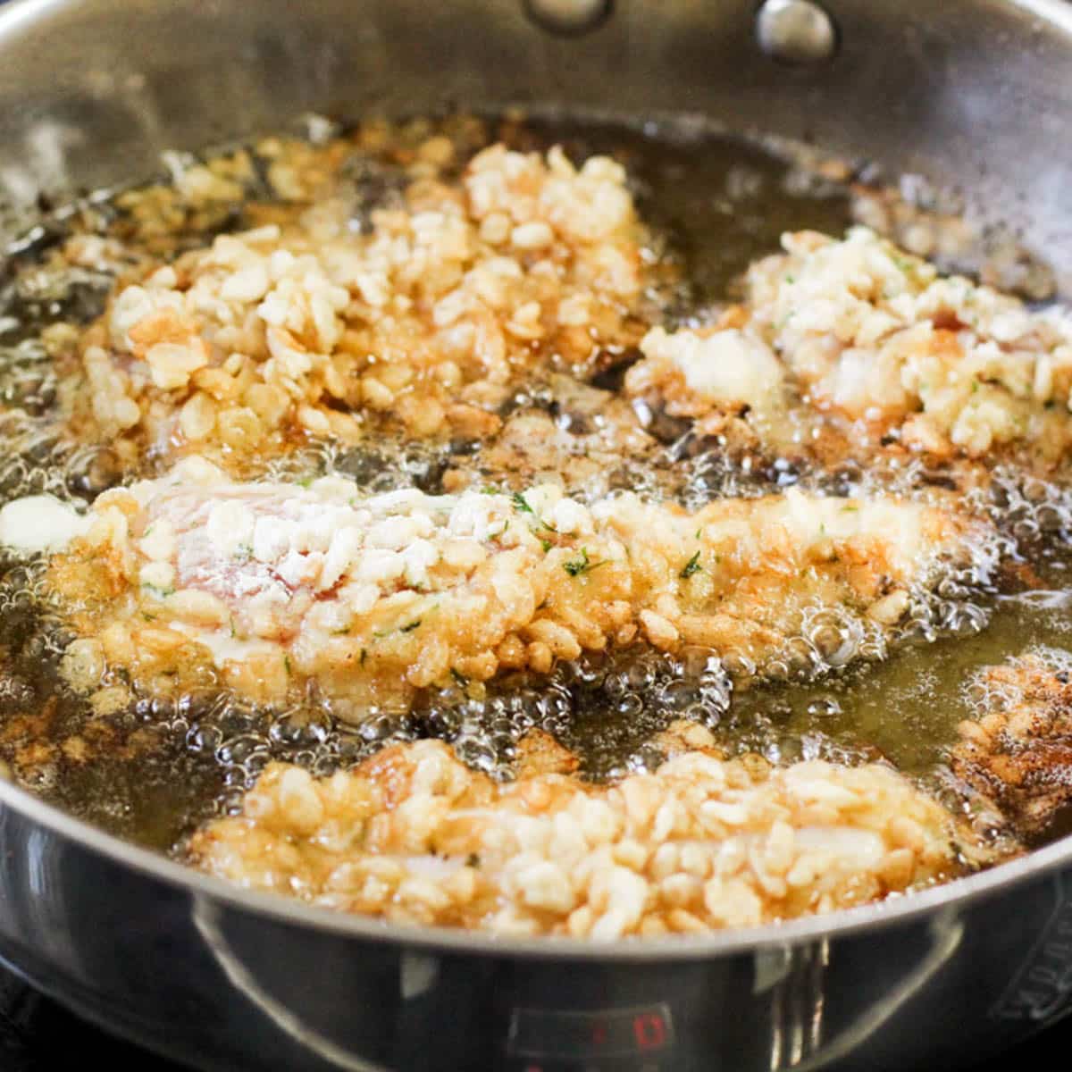 rice krispie chicken frying in oil