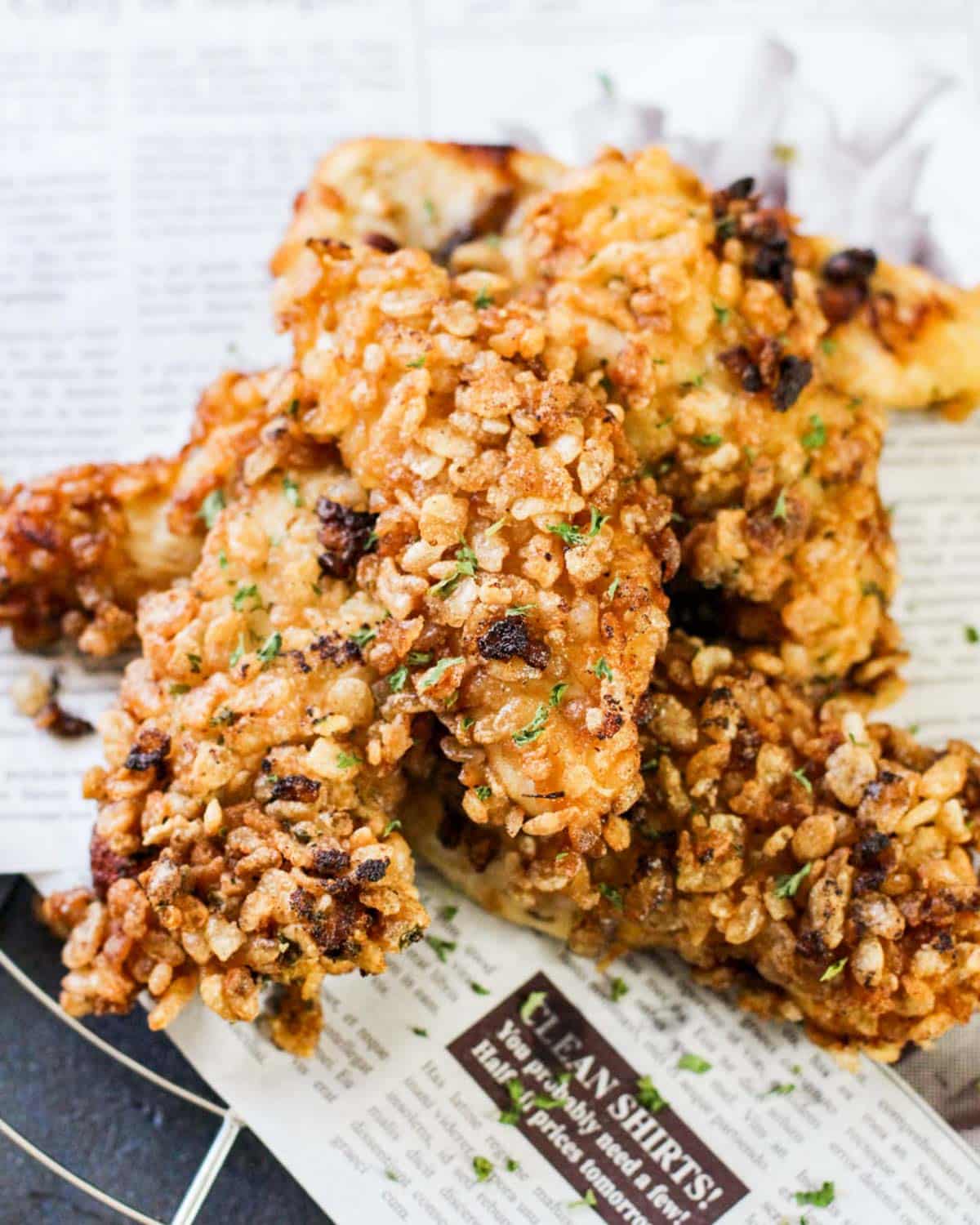 rice krispie chicken on parchment paper on a table