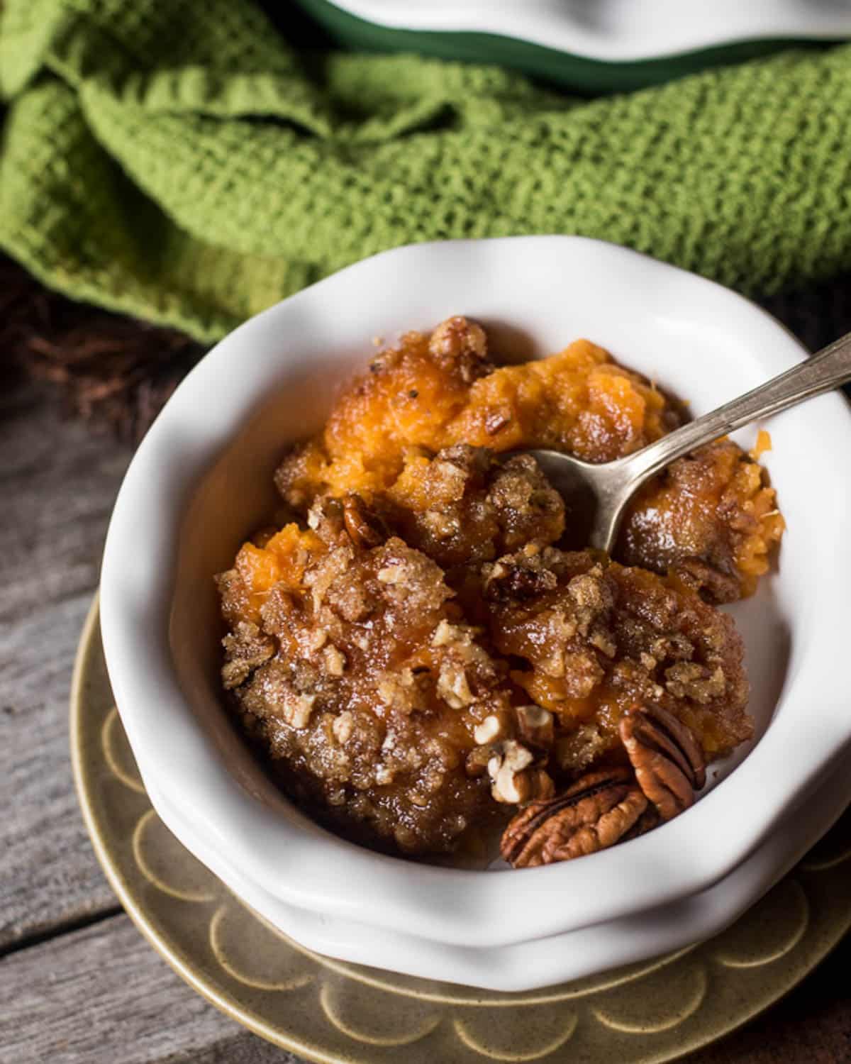 sweet potato casserole with pecans on a table