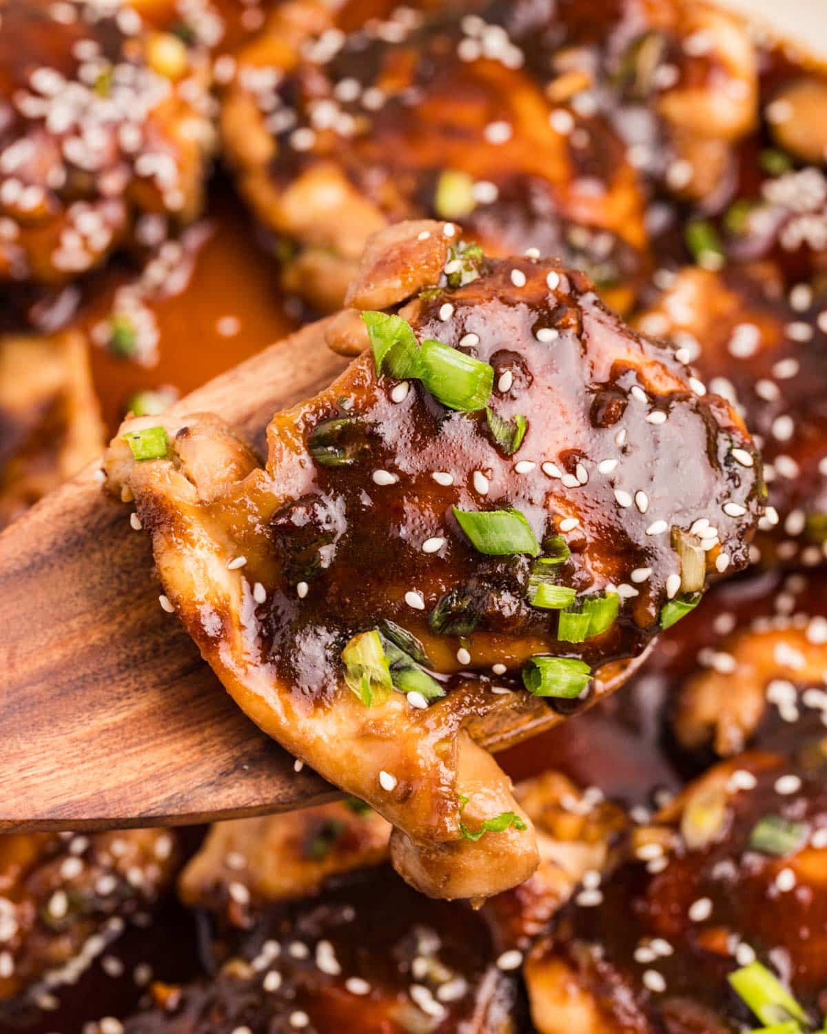 a piece of teriyaki chicken on a spatula