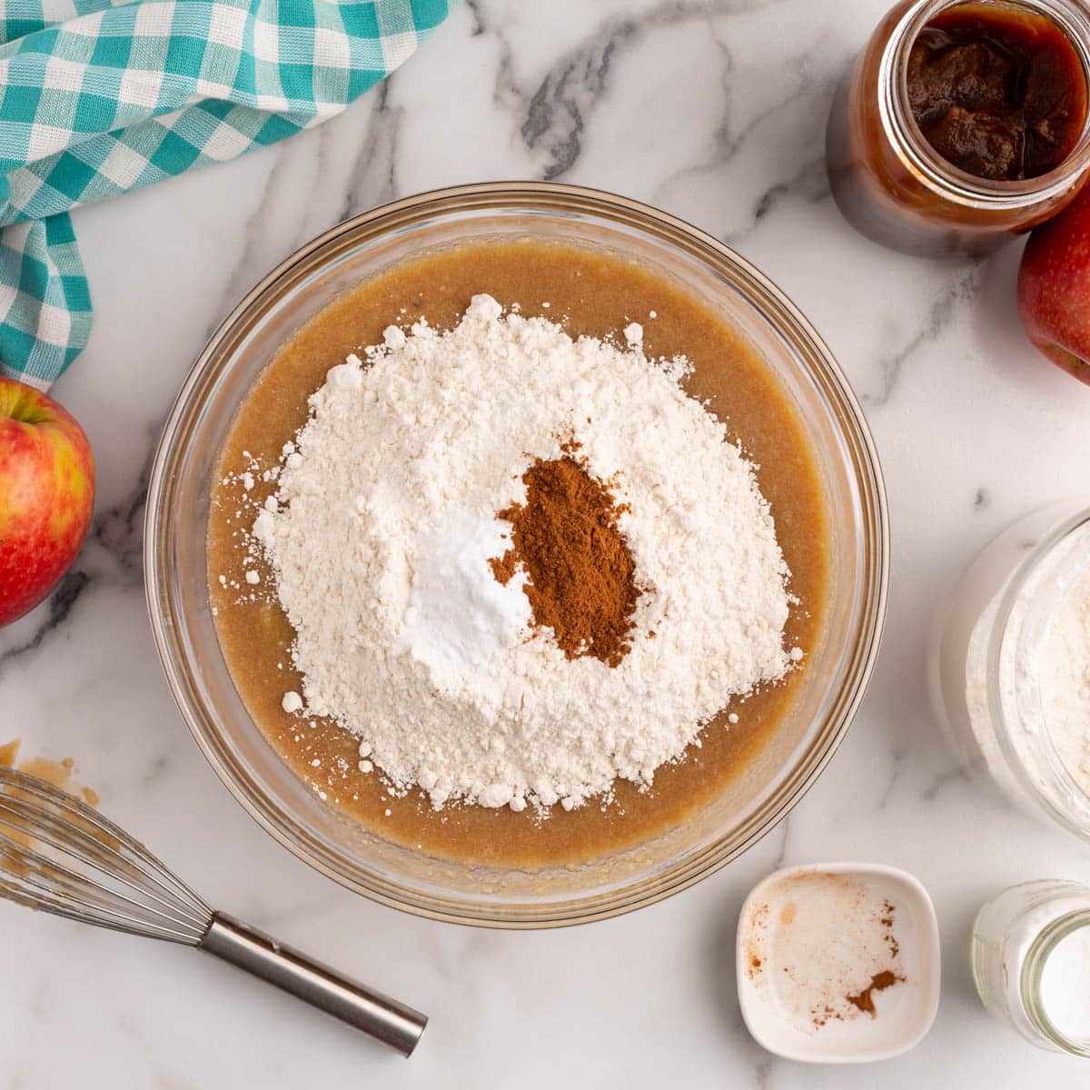 dry ingredients over cake batter in a bowl