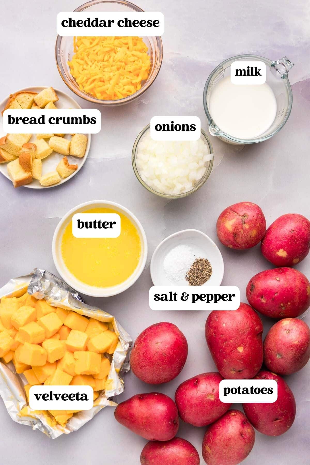 ingredients for cheesy potatoes on a table