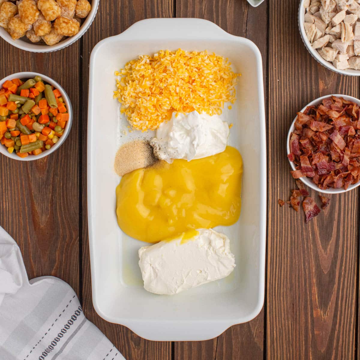 cheese, condensed soup and seasonings unmixed in a baking dish