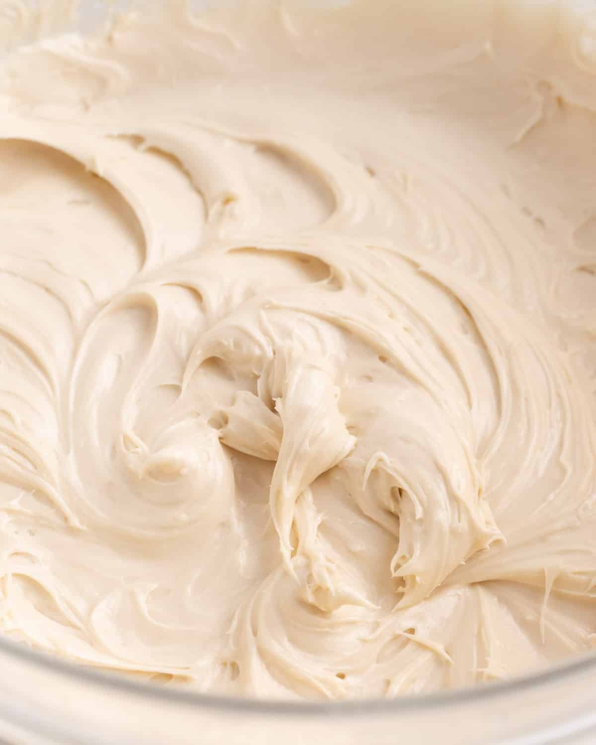 a bowl of cinnamon roll icing